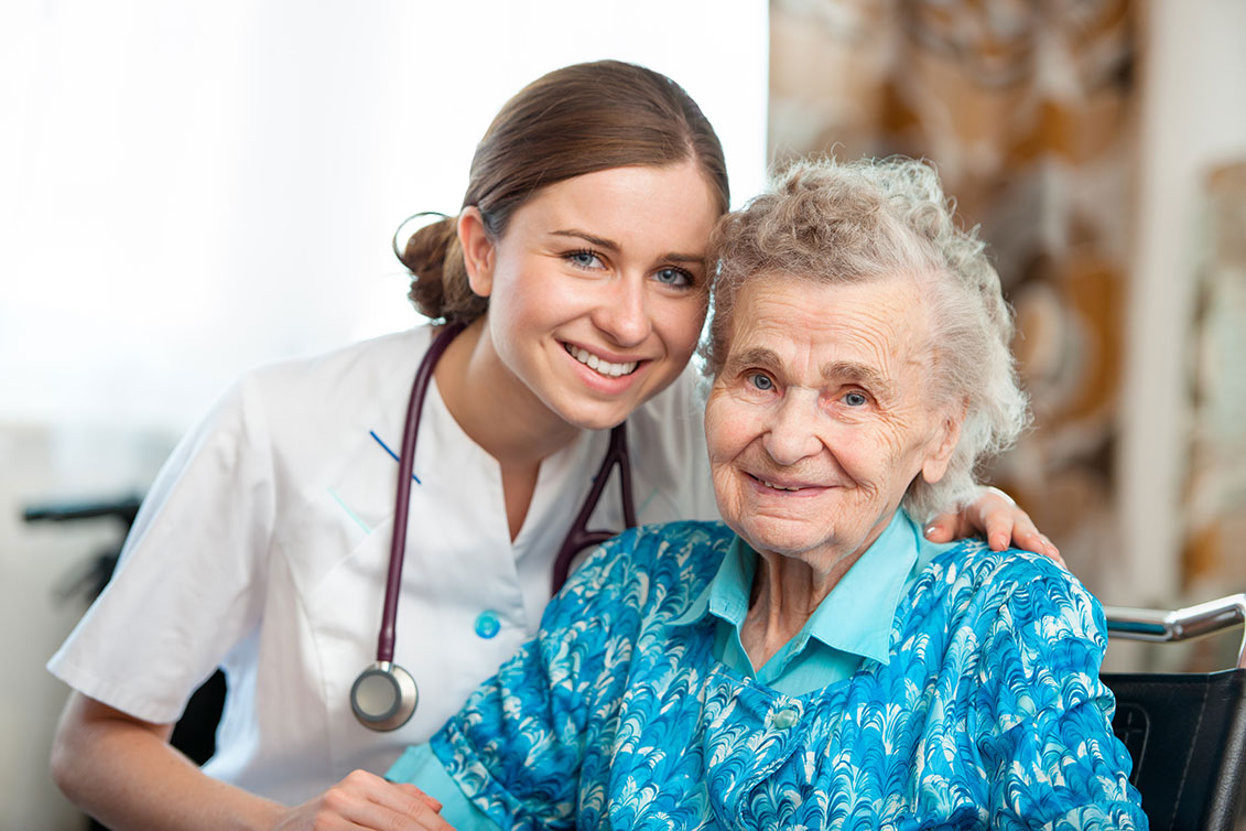 Woman nurse with elderly woman
